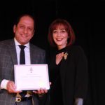 Maryam Naemi receiving award from MP Ali Ehssassi