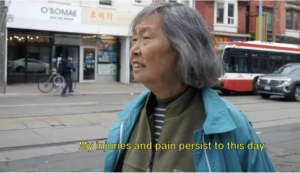 Injured worker looks out onto Spadina Strret