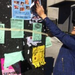 injured worker posting campaign notice on the Danforth