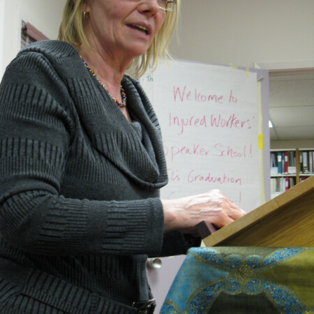 Welcoming injured workers and guests to Speaker School graduation 2011 Marion Endicott welcoming injured workers and guests to Speaker School