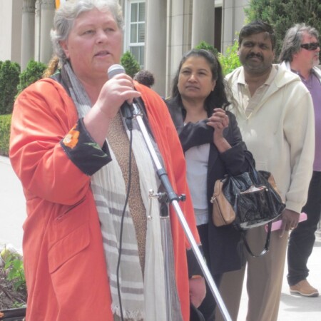 Myra speaks to the rally, 2014